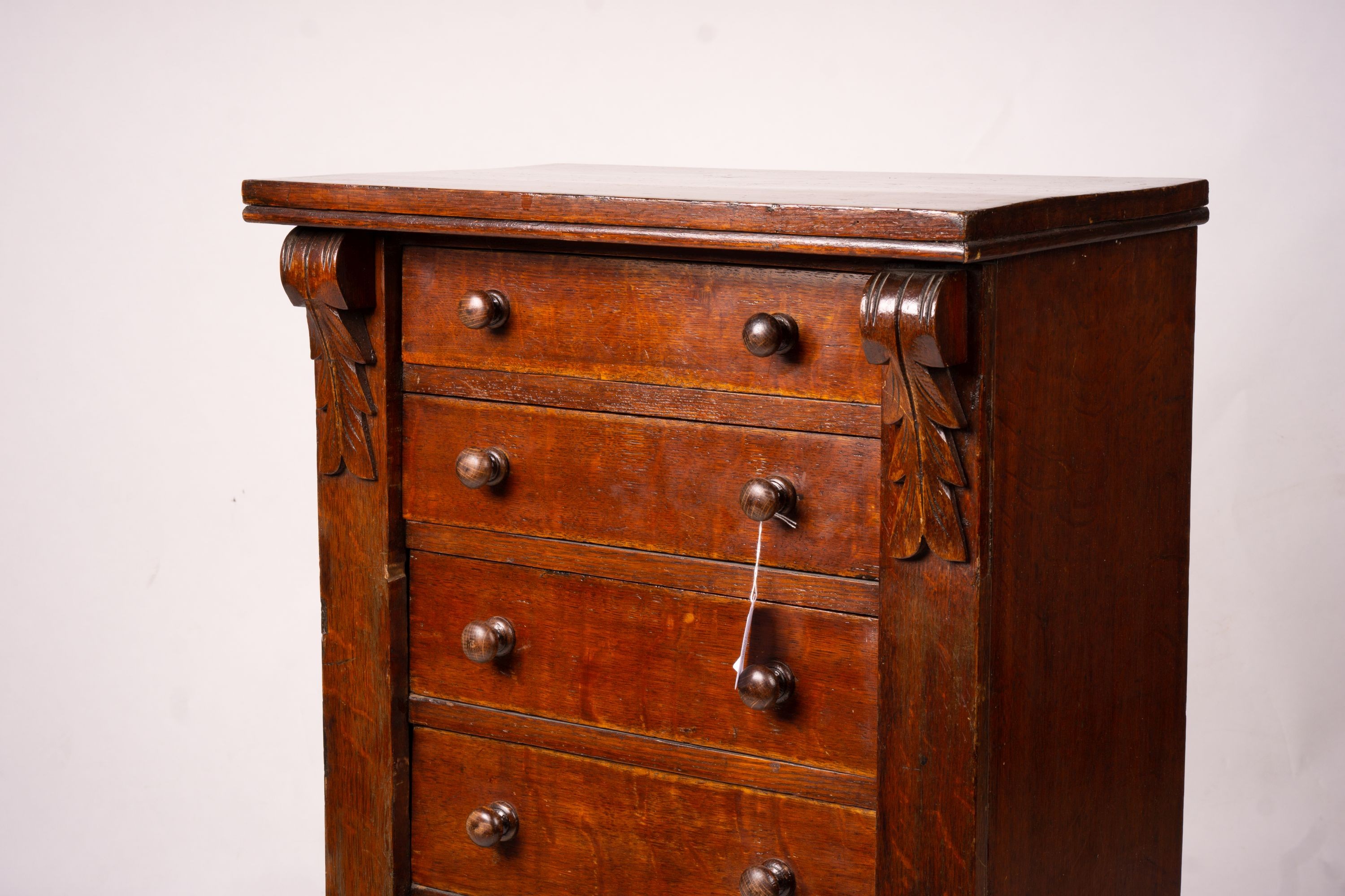 A late Victorian oak Wellington chest, width 51cm, depth 34cm, height 100cm